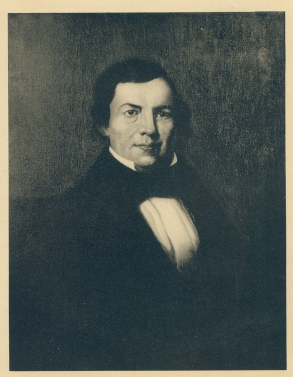 Black-and-white photograph of a painted portrait of William Marsh Rice in middle age: a clean-shaven man with dark hair brushed forward, a high forehead, steady eyes, and a slight, guarded smile, wearing a dark coat, black stock, and white shirt front against a plain dark ground.